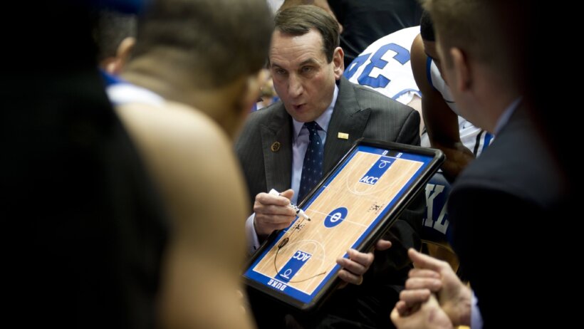 Duke coach Mike Krzyzewski running a huddle.