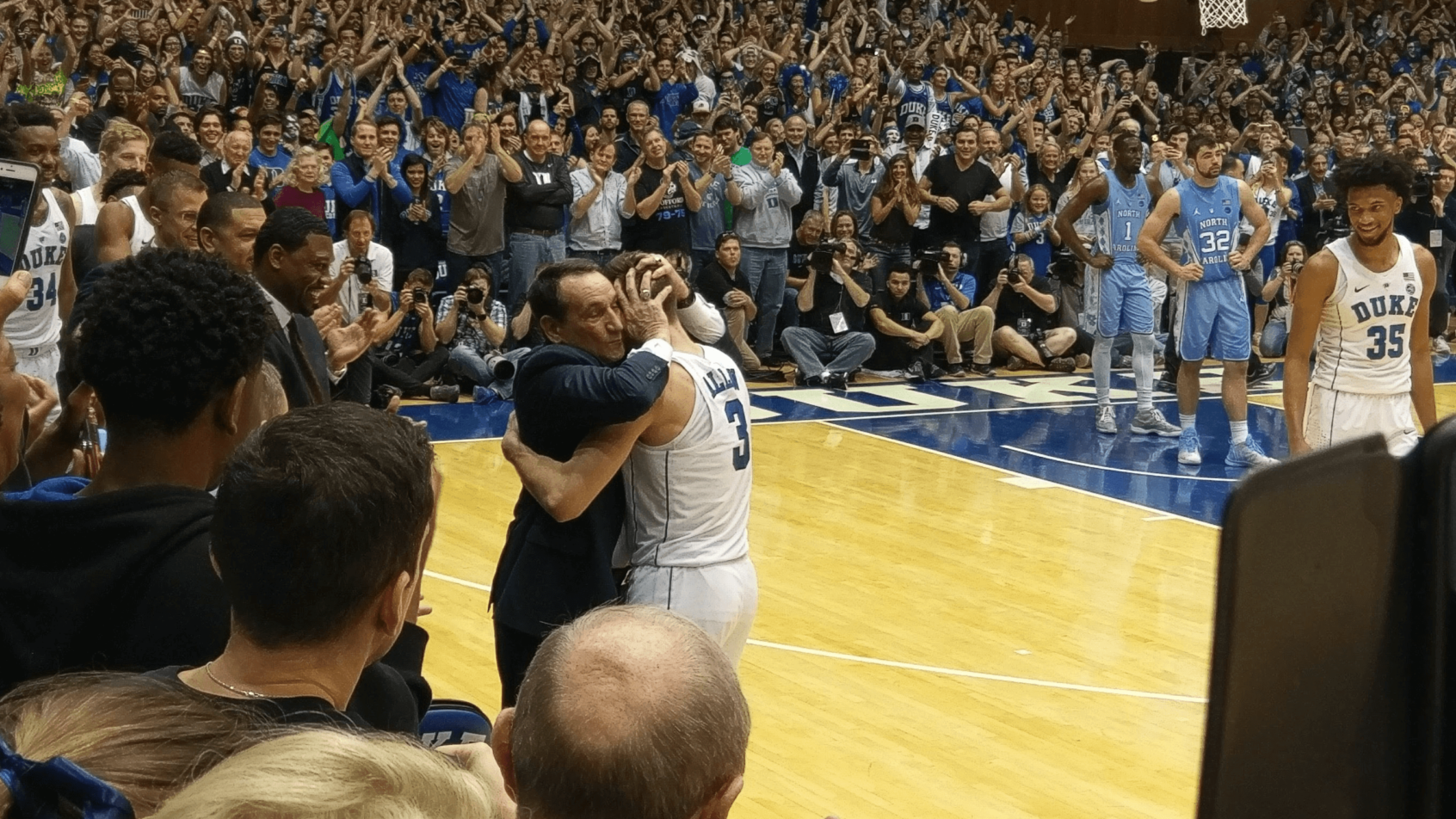 Duke coach Mike Krzyzewski hugging guard Grayson Allen