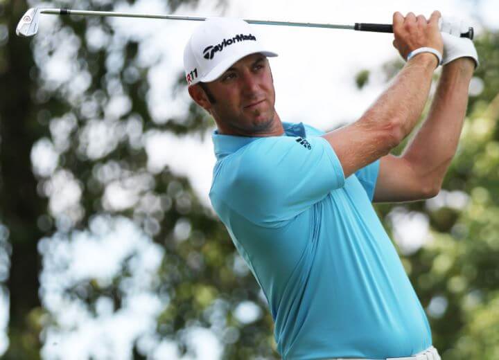 Dustin Johnson follows through on an iron shot.