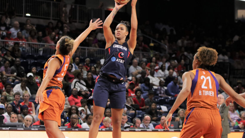 Washington Mystics player shooting basketball.