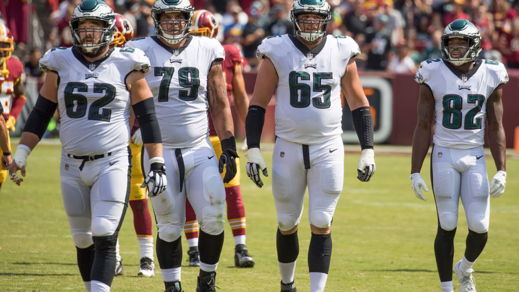 Eagles offensive line walking back to the huddle