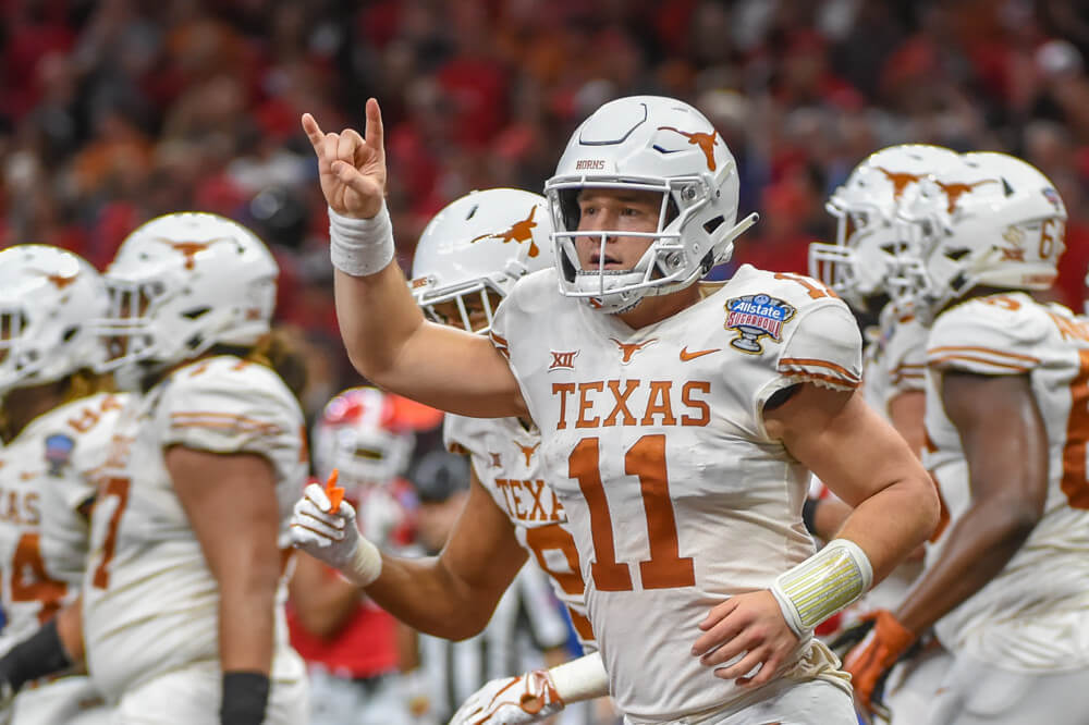 Texas QB Sam Ehlinger flashing the horns