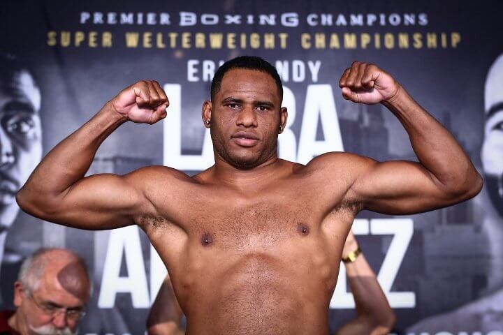 Frank Sanchez Faure flexing at a weigh in