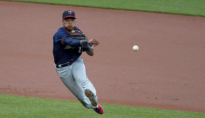 Jorge Polanco throwing to first base.