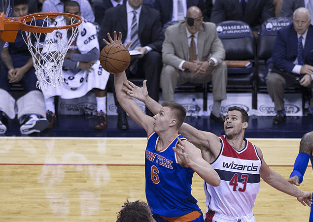Knicks center Kristaps Porzingis lays the ball in.