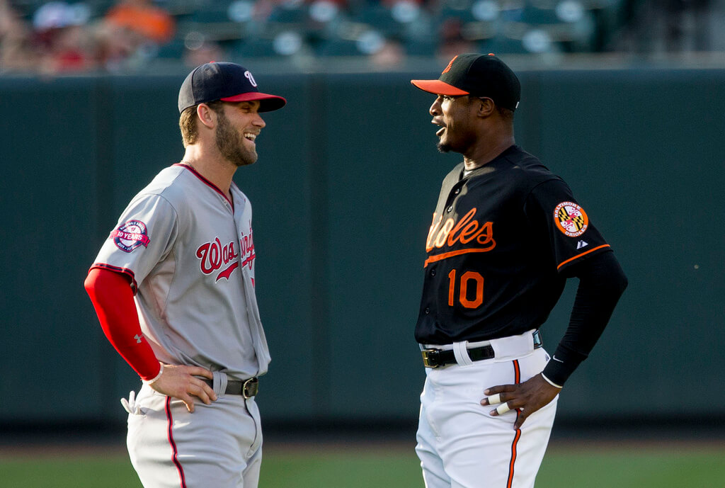 The Nationals' Bryce Harper talking with the Orioles' Adam Jones before a game.