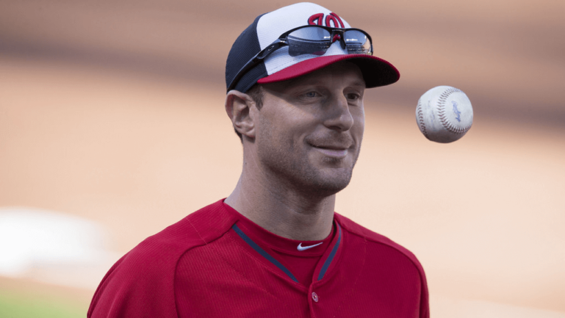 Nationals pitcher Max Scherzer flipping the ball.