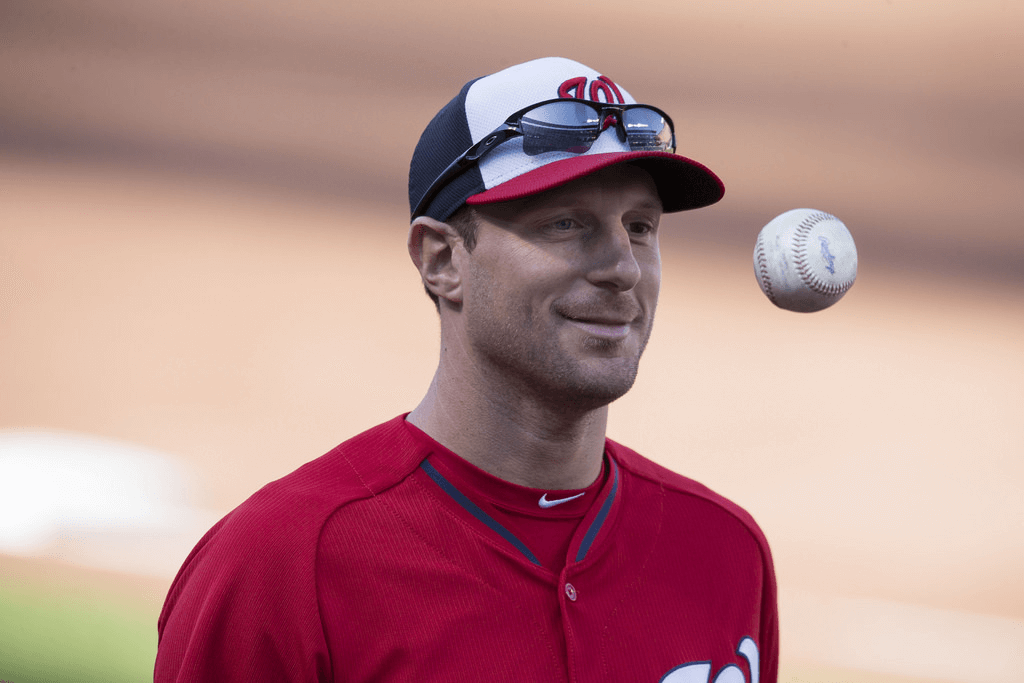 Nationals pitcher Max Scherzer flipping the ball.