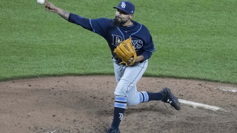 Sergio Romo pitching for Tampa Bay