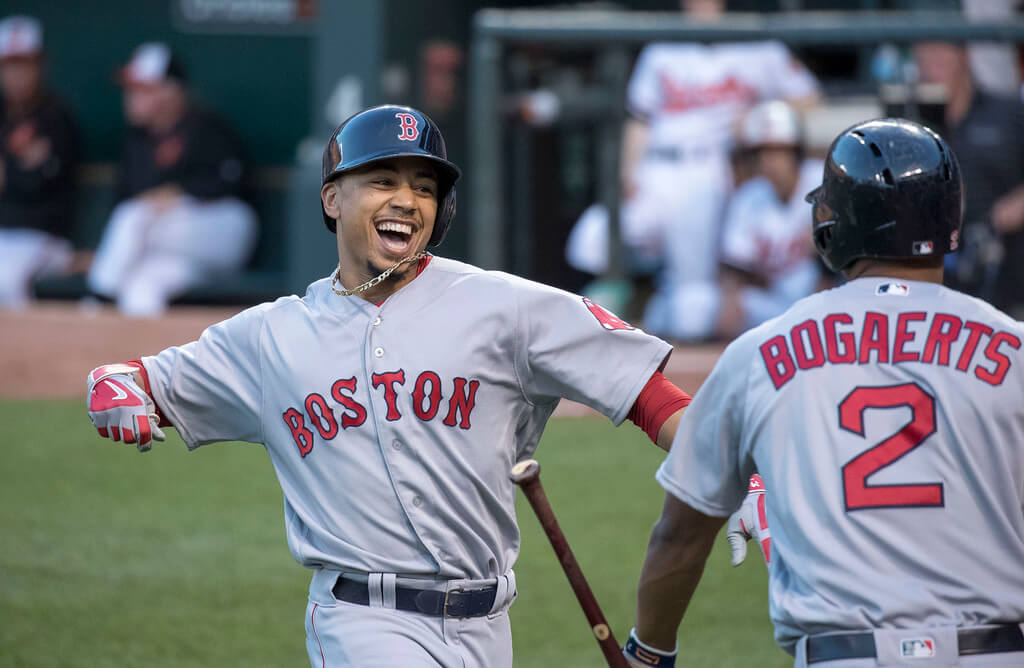Red Sox RF Mookie Betts celebrating with shortstop Xander Bogaerts