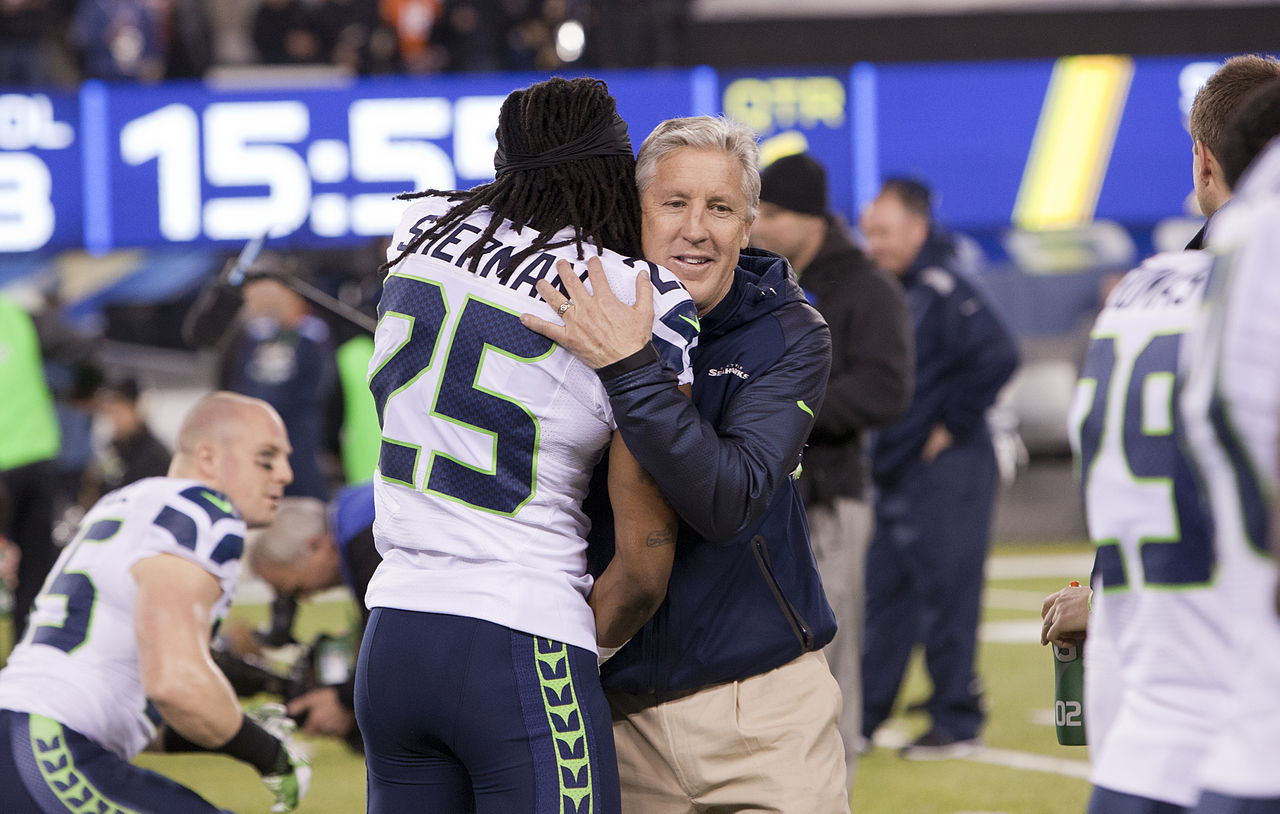 Sherman and Pete Carroll hugging