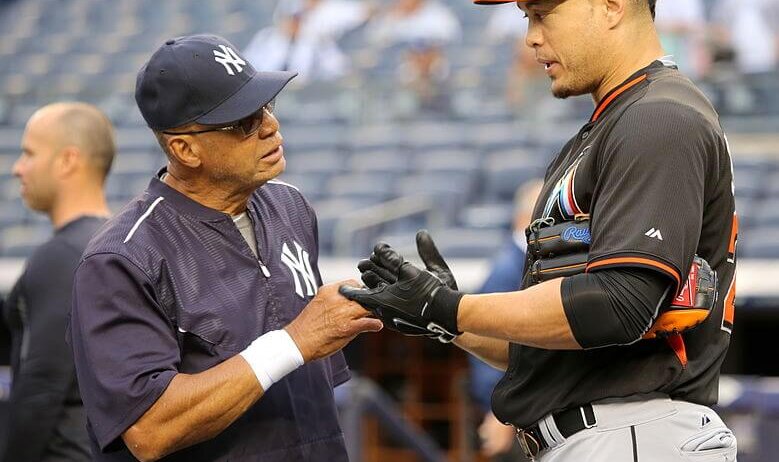 Giancarlo Stanton talking with Reggie Jackson