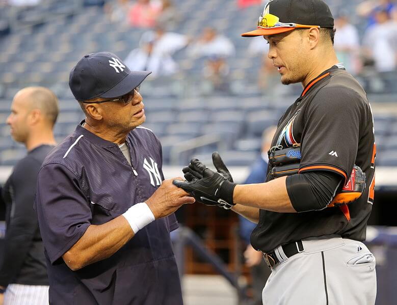 Giancarlo Stanton talking with Reggie Jackson