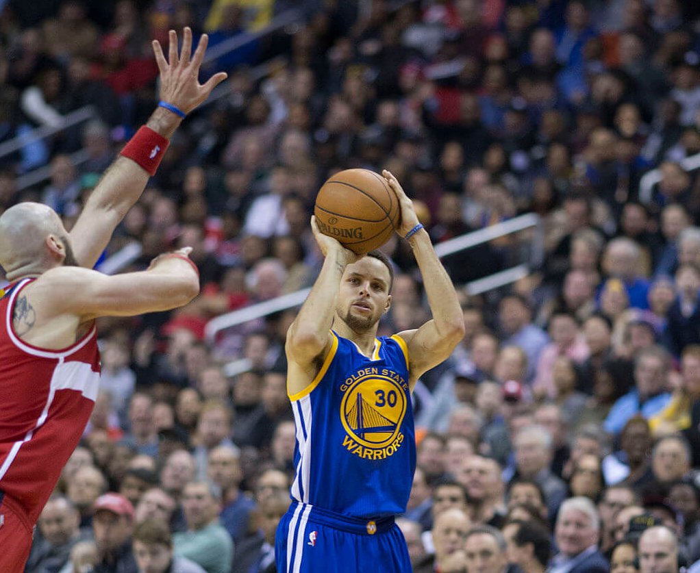 Steph Curry shooting from behind the arc.