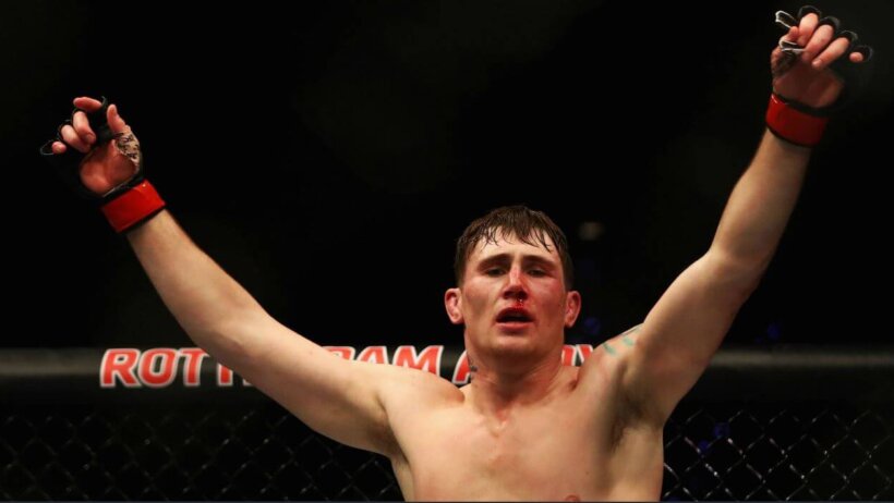 Darren Till with hands raised.