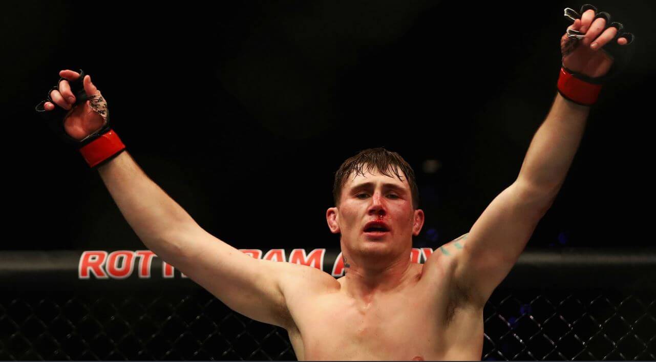 Darren Till with hands raised.