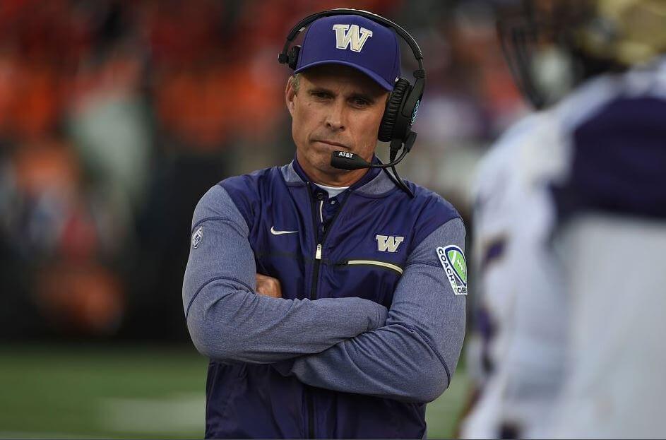 Huskies head coach Chris Petersen scouring on the Washington sideline.