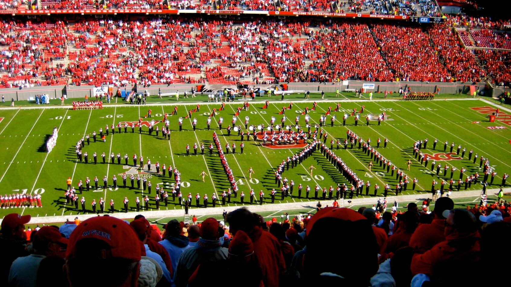 Wide shot of NC State marching band on the field