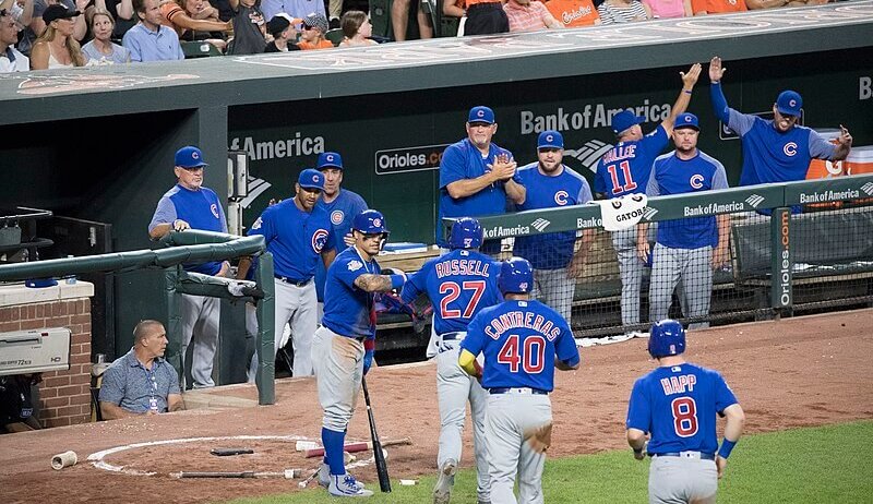 Chicago Cubs players walking back to the dugout.