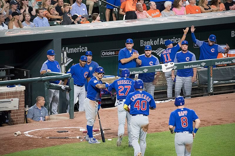 Chicago Cubs players walking back to the dugout.