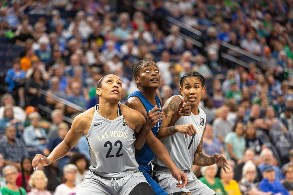 Las Vegas Aces players battle for a rebound.