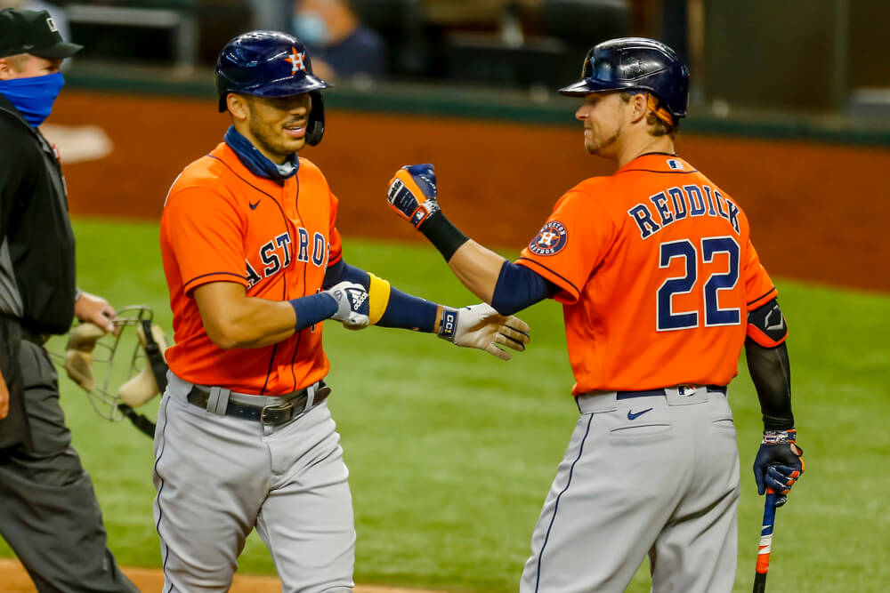 Carlos Correa and Josh Reddick celebrating a home run
