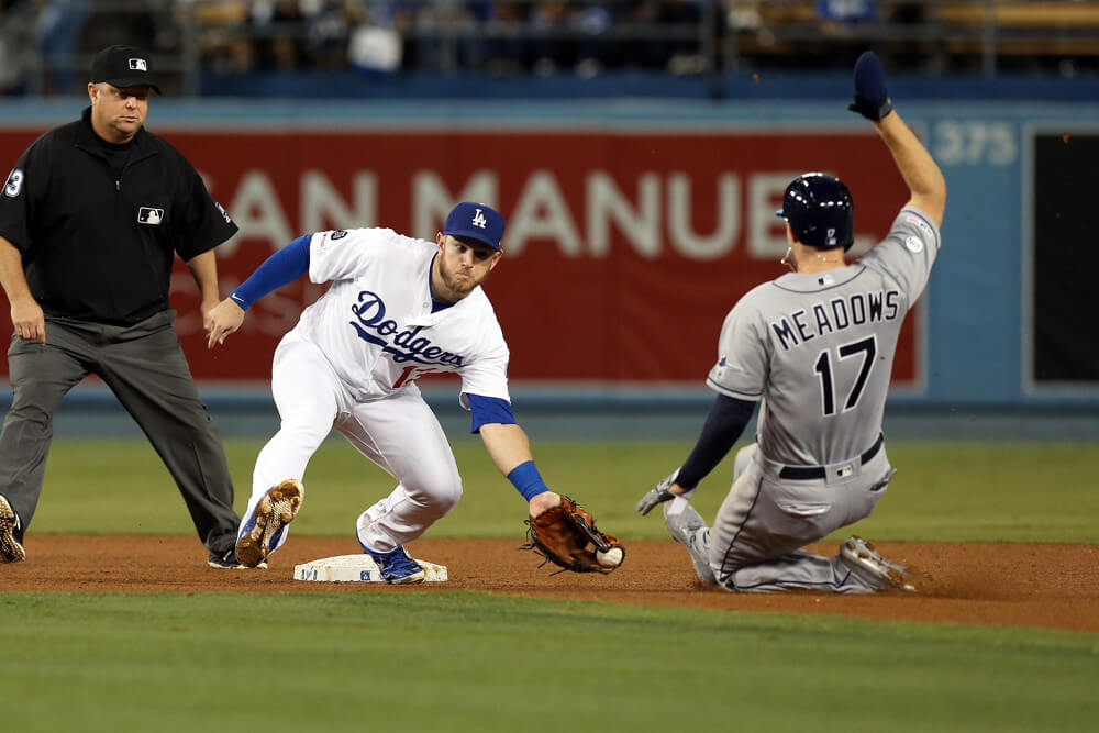 Max Muncy laying a tag on Austin Meadows at second base