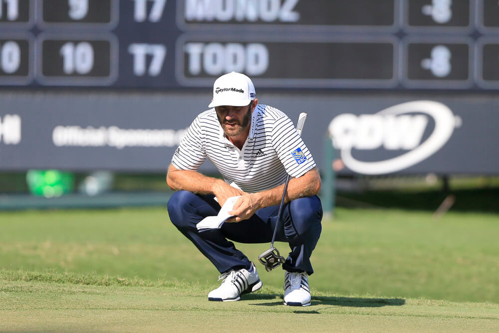 Dustin Johnson measuring up a putt