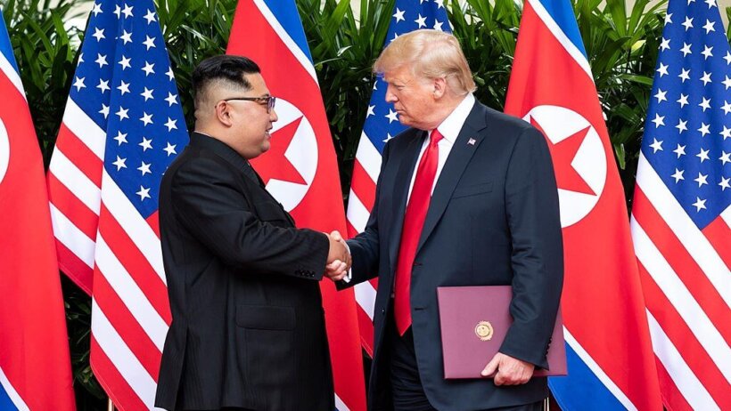 Kim Jong-un shaking hands with Donald Trump