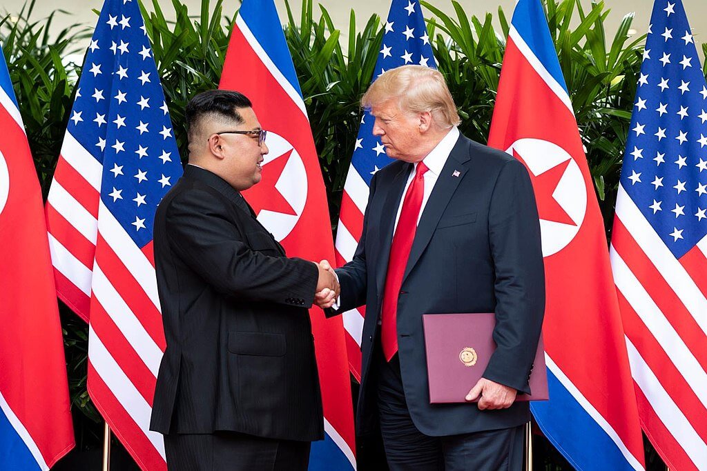 Kim Jong-un shaking hands with Donald Trump