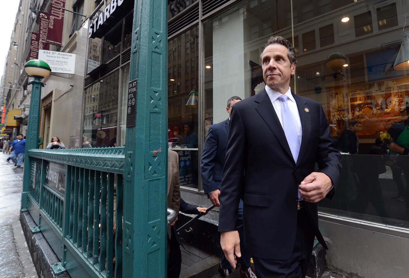 Governor Andrew Cuomo coming out of the subway.