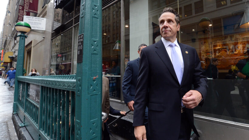 Governor Andrew Cuomo coming out of the subway.