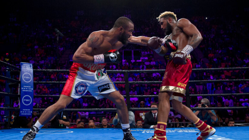 Julian Williams throwing a jab to the body of Jarrett Hurd