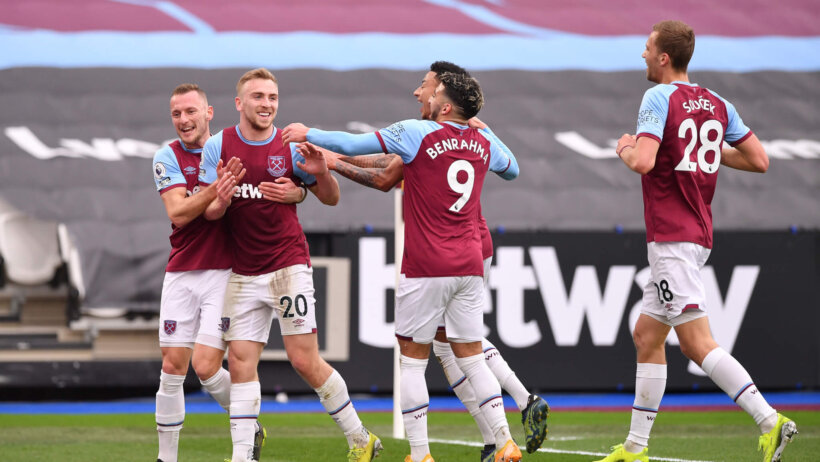 West Ham's Jarrod Bowen celebrating with his teammates after scoring a goal during a soccer match.