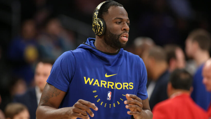 Draymong Green with headphones on in warmup