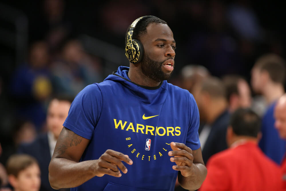 Draymong Green with headphones on in warmup