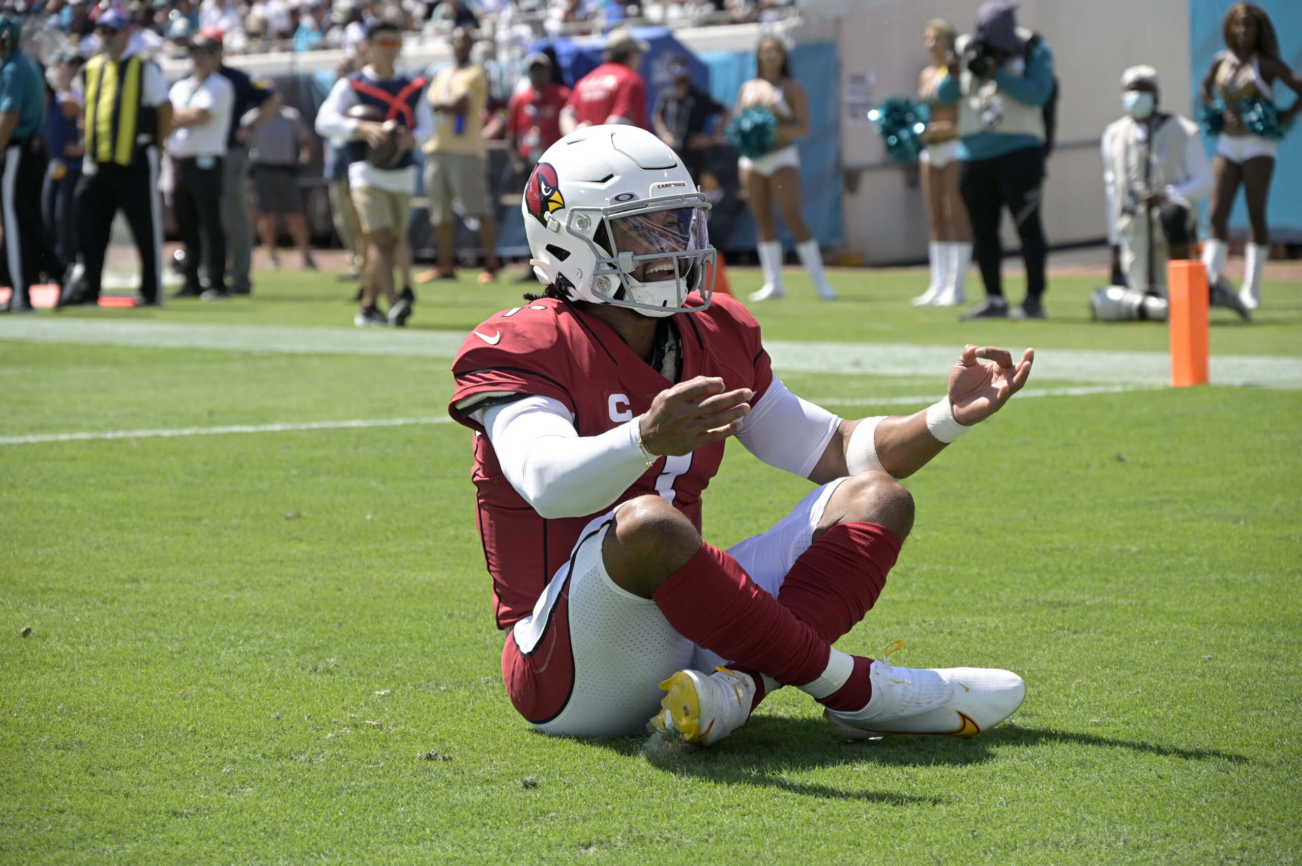 Arizona Cardinals quarterback Kyler Murray celebrating in the end zone after scoring a touchdown.