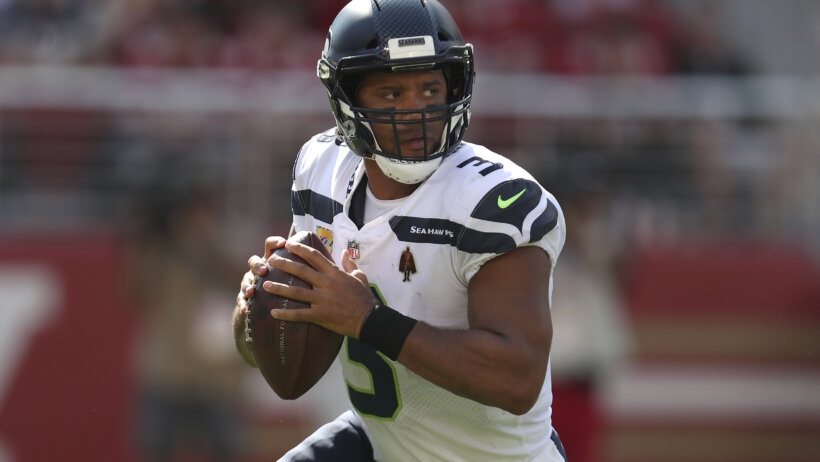 Russell Wilson running with football