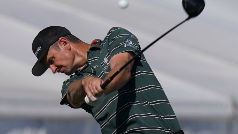 Justin Rose hits a tee shot