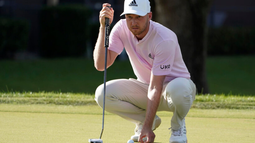 Daniel Berger lines up a putt