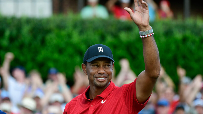 Tiger Woods waves