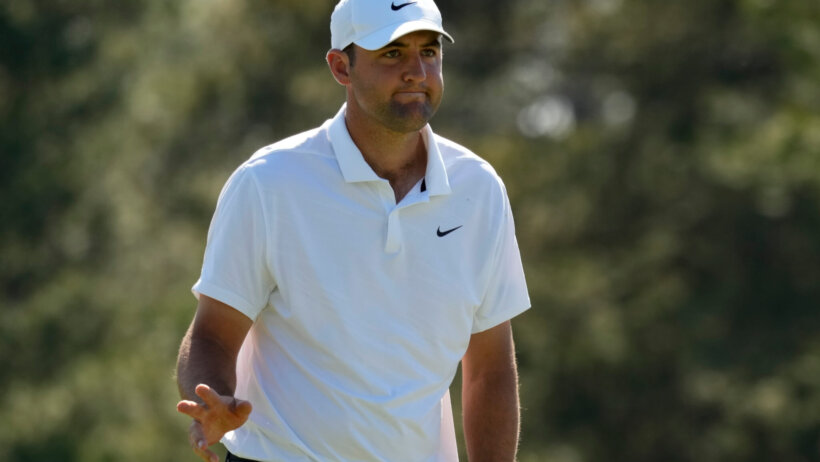Scottie Scheffler waving to the crowd at the Masters
