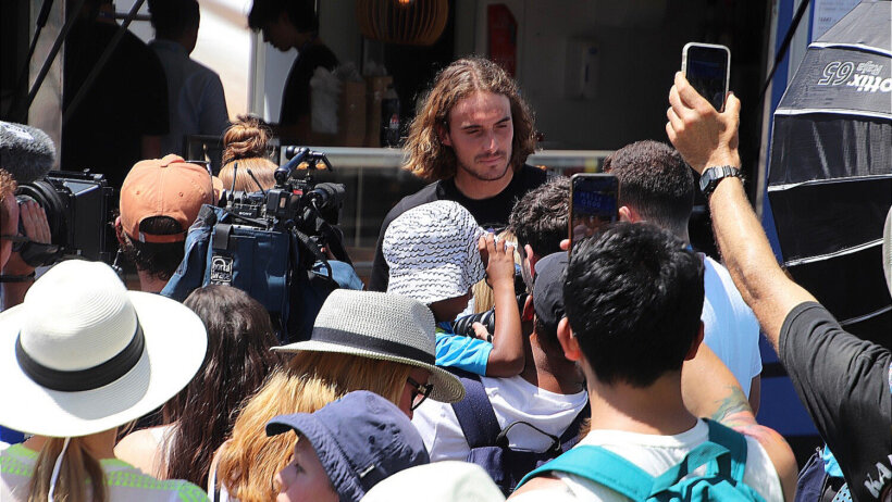 Stefanos Tsitsipas surrounded by fans