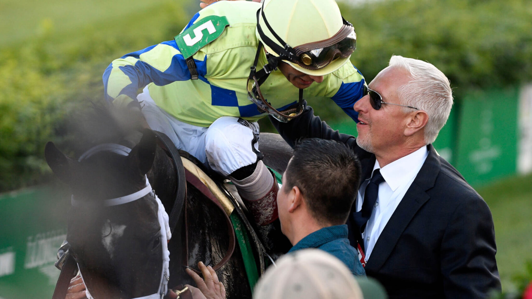 John Velazquez aboard Always Dreaming (5) celebrates with trainer Todd Pletcher