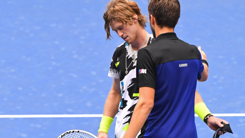 Daniil Medvedev shakes hands with Andrey Rublev