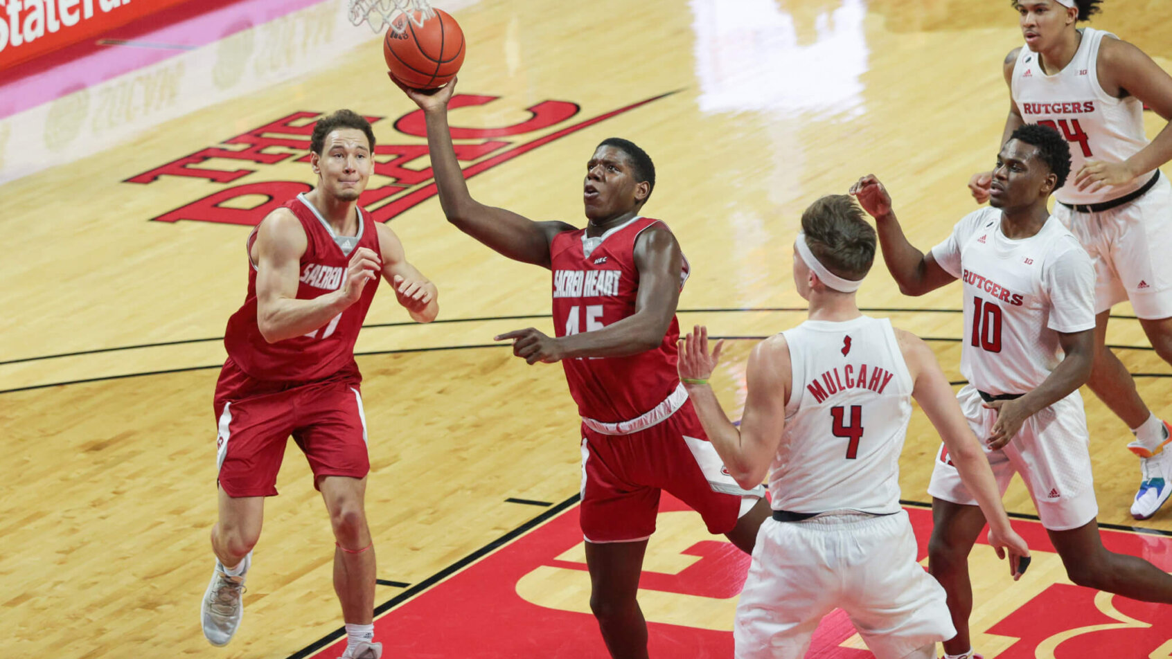 Sacred Heart Pioneers forward Nico Galette lays the ball into the hoop