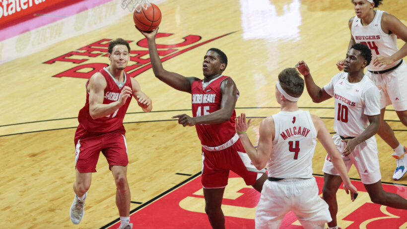 Sacred Heart Pioneers forward Nico Galette lays the ball into the hoop