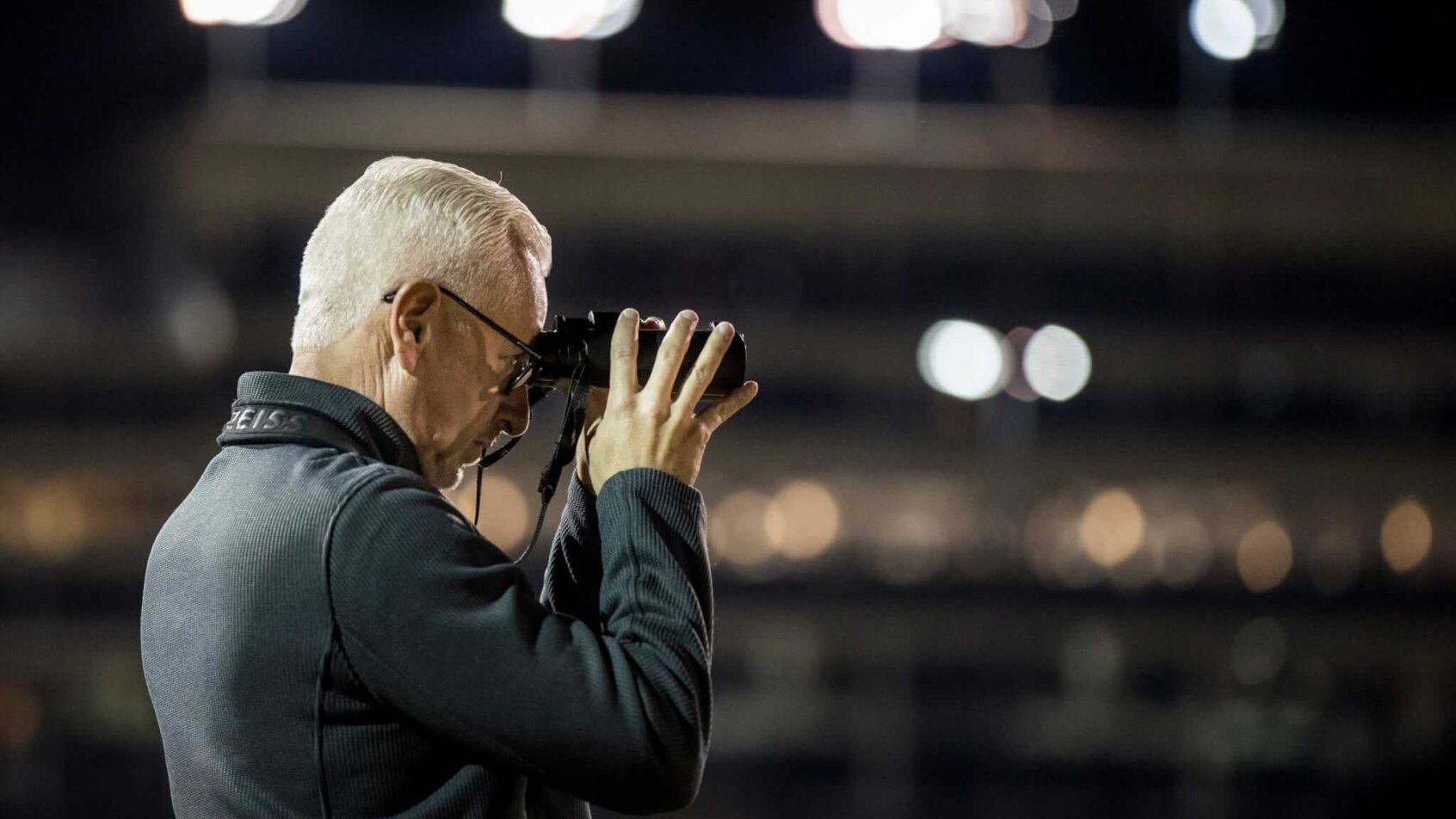 Trainer Todd Pletcher watches his horses workout in the morning on the track at Churchill Downs.