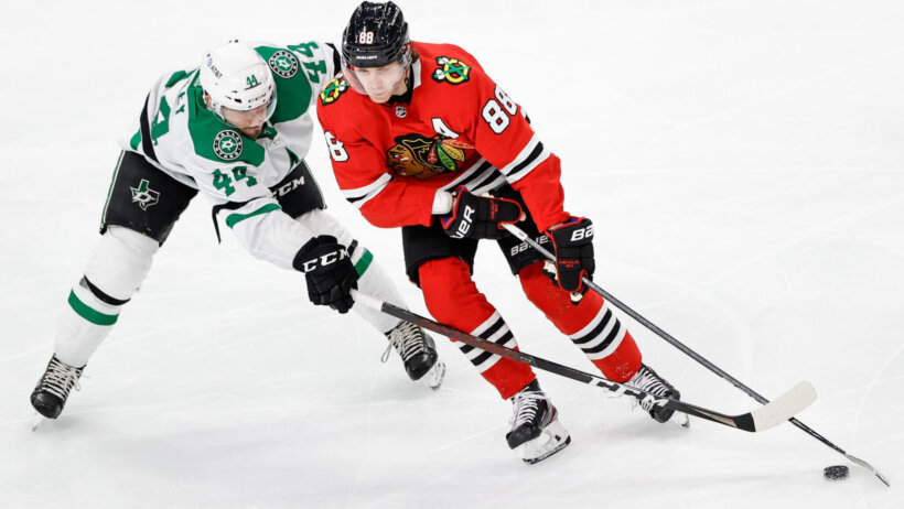 Chicago Blackhawks right wing Patrick Kane keeps the puck away from Dallas Stars defenseman Joel Hanley