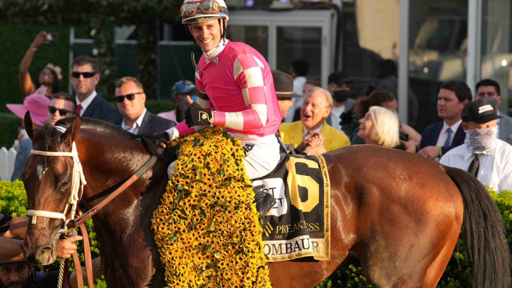 Jockey Flavien Prat and Rombauer in the Winners Circle after winning the 146th running of the Preakness Stakes
